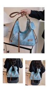 Detailed views of light blue washed canvas tote with leather straps and round mini pouch