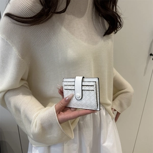Elegant white woven card holder wallet with snap fastener shown in hand for women