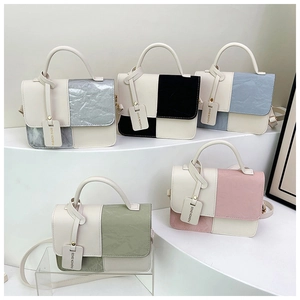 Detail view of stylish PU leather crossbody bags in five colors with wrinkled texture flap