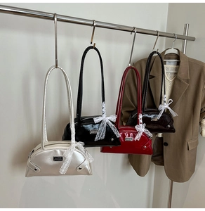 Details of bowling handbags in four colors with lace bows and shiny leather finish