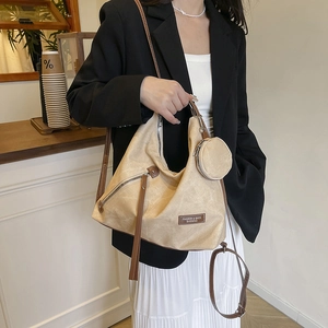 Minimalist beige large capacity tote bag with matching round pouch and brown strap