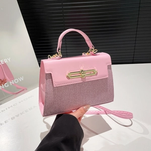 Pink vintage mini crossbody bag with glitter texture and gold turn-lock closure