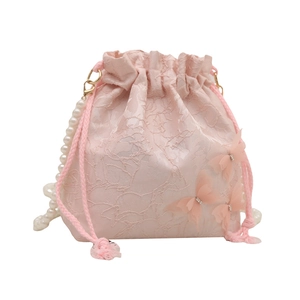Pink jacquard bucket bag with floral texture, 3D butterfly appliques and pearl chain strap