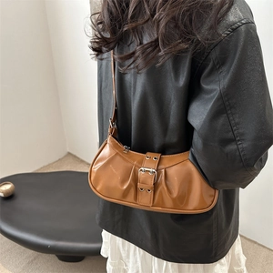 Vintage brown pleated saddle bag with metallic buckle strap for stylish women