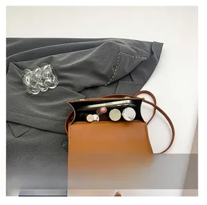Top view of open leopard print crossbody bag showing spacious interior for essentials