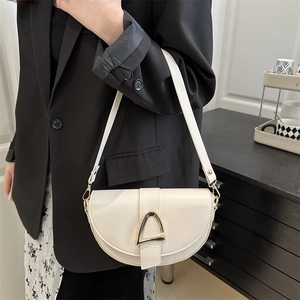 Chic cream leather saddle shoulder bag with gold hardware for women's spring fashion