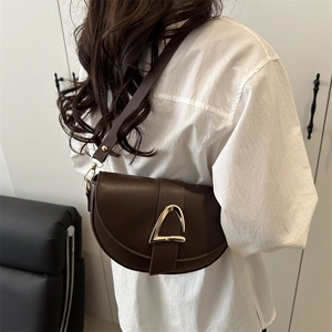 Retro brown saddle bag with gold triangle buckle and adjustable leather strap