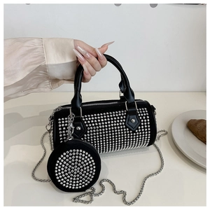 Detail of black rhinestone barrel bag with silver chain and matching mini coin purse