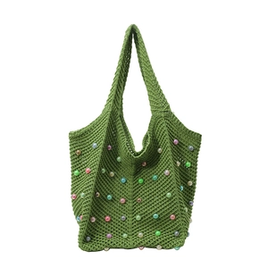 Green knit tote bag with colorful beads and pearl accents for summer beach style