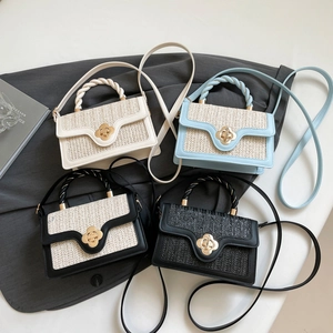 Fashionable woven crossbody bag with metal flower clasp in four versatile colors