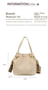 Detail of cream PU bucket bag with ethnic woven wide strap and 24x14x24cm dimensions