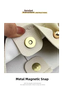 Close-up of golden magnetic snap closure on cream white lychee leather bucket bag