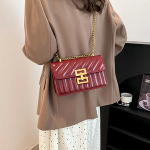 Chic burgundy quilted leather crossbody bag with elegant gold chain strap and metal lock