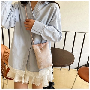 Detailed embroidery texture and elegant pearl buckle on the pink jacquard phone bag