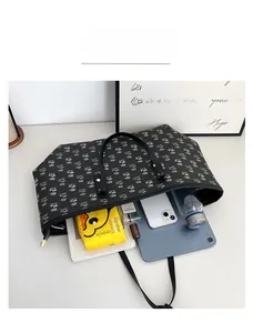 Top view of large tote bag interior showing capacity for tablet, phone and daily essentials