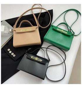 Three elegant leather handbags in beige, green, and black with golden metal clasps