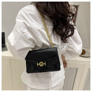 Detailed back view of a black leather crossbody bag with chain strap and gold M logo
