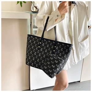 Detailed view of black palm print tote bag set with matching small zipper pouch