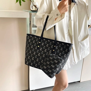 Two-piece black tote bag set with palm tree print and matching small pouch for women