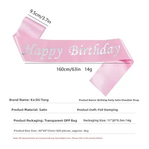 Detail view of pink satin birthday sash with silver Happy Birthday foil stamping text