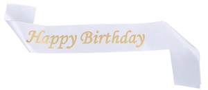 Detail of white satin sash with gold Happy Birthday foil lettering for party decorations