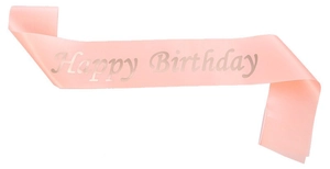 Close-up of pink satin Happy Birthday sash with elegant silver foil lettering for parties