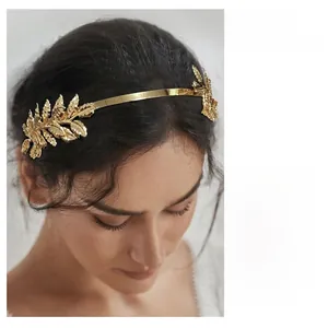 Detail of golden leaf bridal headband featuring laurel leaf design for wedding hair styling