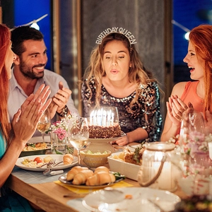 Close-up of birthday queen rhinestone headband worn by woman during party celebration