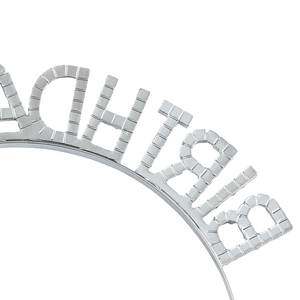 Macro detail of silver Birthday Girl headband showing metallic texture and letter patterns