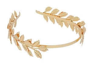 Detail view of golden laurel leaf headband with polished metallic leaves for bridal hair