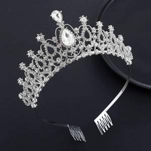 Detailed view of bridal crystal crown with sparkling teardrop rhinestones and hair combs