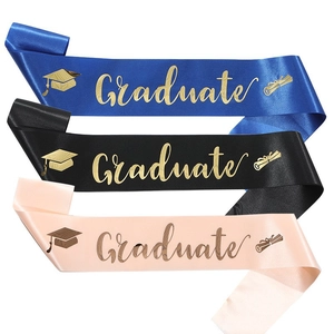 Close-up of Class of 2026 sashes in blue black and pink with gold foil Graduate print