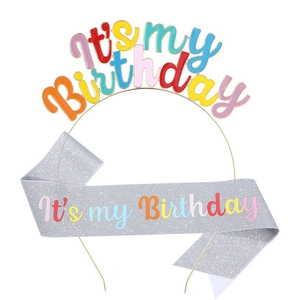 Detail of glittery silver sash and colorful metal headband with It's my Birthday text