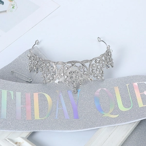 Detail of rhinestone crown and iridescent Birthday Queen sash with a safety pin