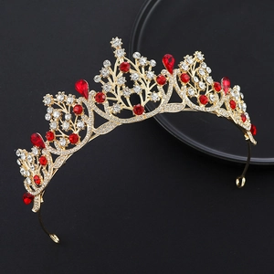 Macro detail of golden bridal crown with sparkling white diamonds and red rubies