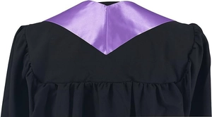 Detail view of black graduation gown featuring a purple satin V-shaped collar and pleats