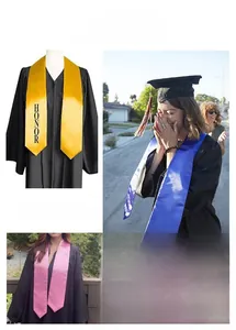 Detail of graduation stoles in shiny gold and blue satin featuring the word HONOR