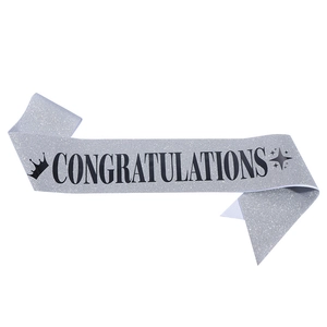 Silver glitter sash with black Congratulations text and crown for graduation parties