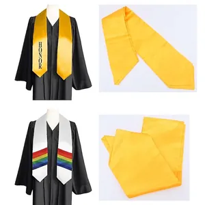 Satin graduation stole in gold with honor text and rainbow striped design on black gown