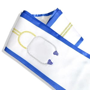 White graduation sash with blue borders and a detailed rhinestone stethoscope design