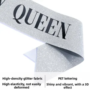 Detail of silver glitter sash with black Queen lettering showing high-density PET texture