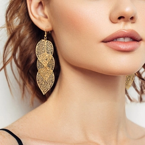 Elegant gold hollow leaf drop earrings with triple-layered filigree design for women