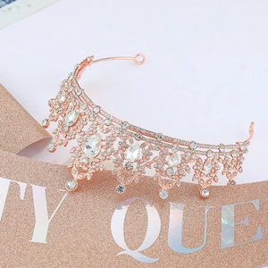 Macro shot of rose gold party crown featuring intricate crystals and rhinestone details