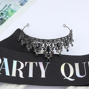 Detail of vintage black crystal crown and Party Queen sash for party costume