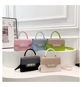 Group shot of colorful square crossbody bags on a white tiered display stand