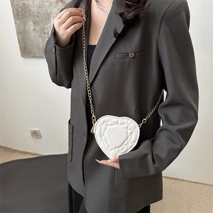 Chic white heart-shaped quilted shoulder bag with elegant gold chain strap for women