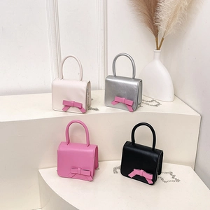 Mini contrast bow square handbags in cream, silver, pink, and black with chain straps