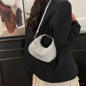 White marble pattern hobo bag with silver bow accent and adjustable shoulder strap