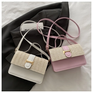 Close-up of woven patchwork detail and golden H-shaped metal buckle on small square bags