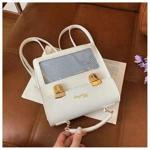 Detail view of cream white PU leather backpack featuring transparent mesh window and gold buckles